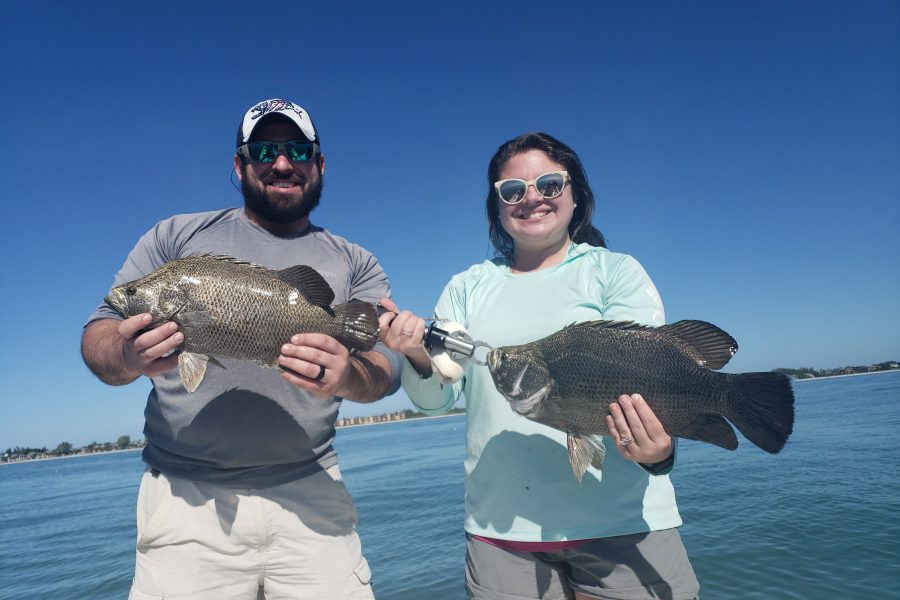Father and daughter with tripletail in Florida - Catch Memories Boatsetter Fishing Giveaway