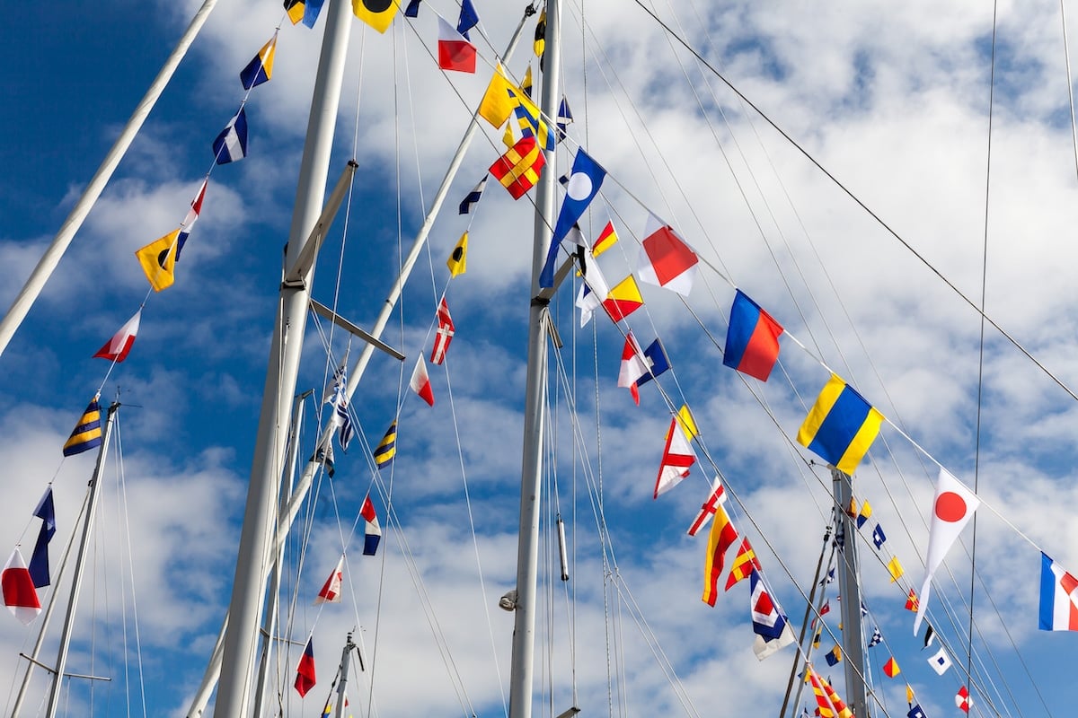 blue flag with yellow sailboat